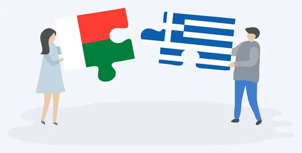 Ζευγάρι Που Κρατά Δύο Κομμάτια Παζλ Μαδαγασκάρης Και Ελληνικές Σημαίες — Διανυσματικό Αρχείο