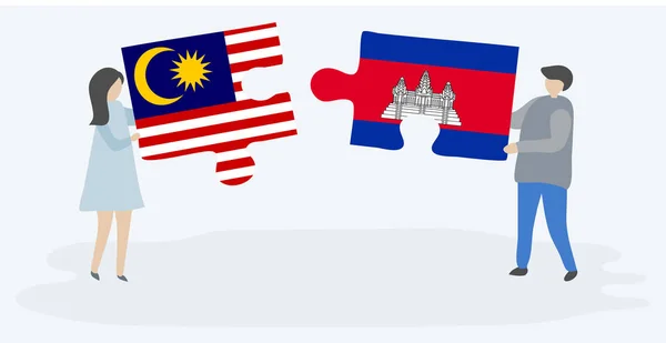 Paar Mit Zwei Puzzleteilen Mit Malaysischen Und Kambodschanischen Flaggen Nationalsymbole — Stockvektor