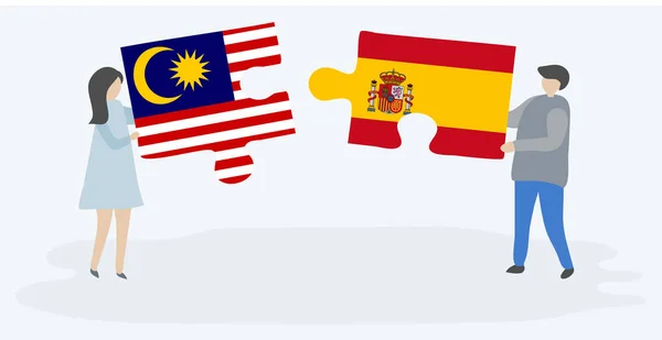 Dvojice Která Drží Dvě Skládanky Malajskými Španělském Prapory Malajské Španělské — Stockový vektor