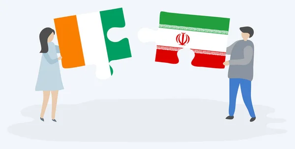 Pareja Sosteniendo Dos Piezas Rompecabezas Con Banderas Marfileñas Iraníes Costa — Vector de stock