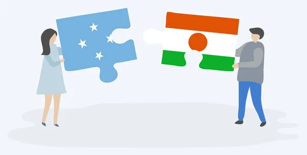 Para Trzyma Dwa Puzzle Kawałki Mikronezyjskich Nigerien Flagi Symbole Narodowe — Wektor stockowy