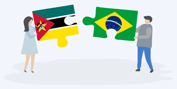 一对夫妇拿着两块拼图 上面挂着莫桑比克和巴西国旗 莫桑比克和巴西国家符号在一起 — 图库矢量图片
