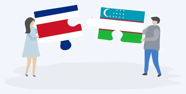 Dvojice Drží Dvě Skládanky Costa Rican Uzbeckými Vlajkami Kostarika Uzbekistán — Stockový vektor