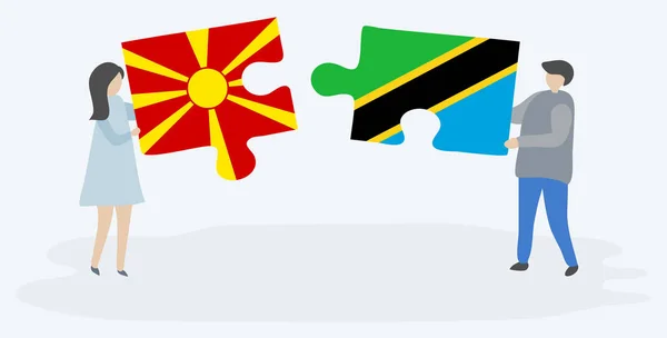 Pareja Sosteniendo Dos Piezas Rompecabezas Con Banderas Macedonias Tanzanas Macedonia — Vector de stock