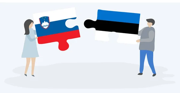 Para Trzymania Dwóch Puzzli Flag Słoweńskich Estońskich Symbole Narodowe Słowenii — Wektor stockowy