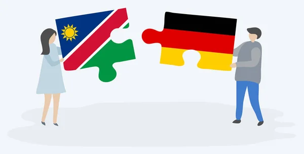 Pareja Sosteniendo Dos Piezas Rompecabezas Con Banderas Namibia Alemania Namibia — Vector de stock