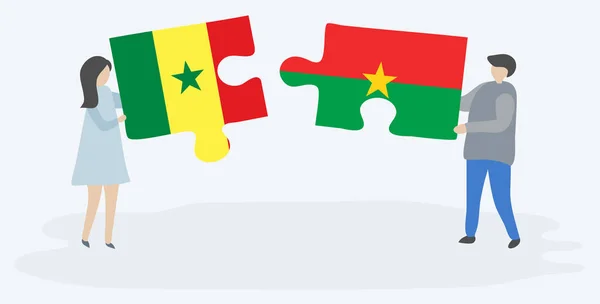 Senegalli Burkinabe Bayrakları Ile Iki Bulmaca Parçaları Tutan Çift Senegal — Stok Vektör