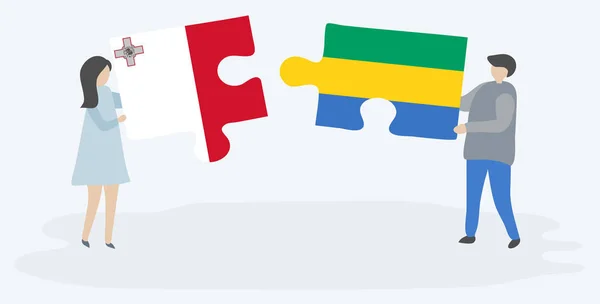 マルタとガボンの旗を持つ2つのパズルピースを保持しているカップル マルタとガボンの国のシンボル — ストックベクタ