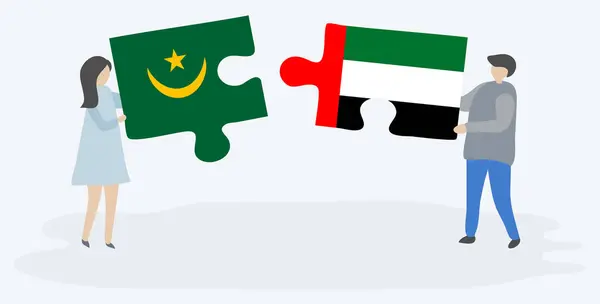 一对夫妇拿着两块拼图 上面挂着毛里塔尼亚和埃米里安国旗 毛里塔尼亚和阿拉伯联合酋长国国家符号在一起 — 图库矢量图片