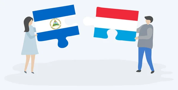 Paar Houden Twee Puzzels Stukken Met Nicaraguaanse Luxemburgse Vlaggen Nicaragua — Stockvector