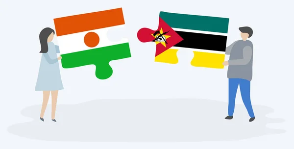 Couple Tenant Deux Pièces Puzzles Avec Des Drapeaux Nigériens Mozambicains — Image vectorielle