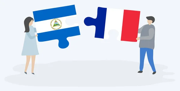 Para Trzyma Dwa Kawałki Puzzli Nikaraguan Flagi Francuskiej Nikaragua Francja — Wektor stockowy