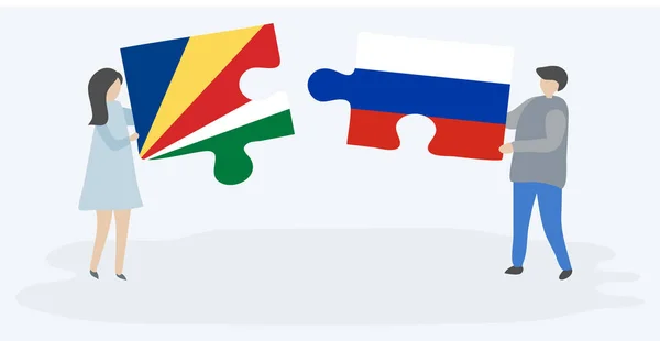 Ζευγάρι Που Κρατά Δύο Κομμάτια Παζλ Σημαίες Σεϋχελλών Και Ρωσικά — Διανυσματικό Αρχείο
