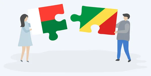 Casal Segurando Duas Peças Quebra Cabeças Com Bandeiras Malgaxes Congolesas —  Vetores de Stock