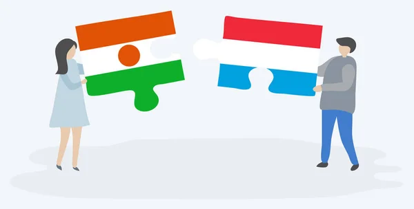 Paar Houden Twee Puzzels Stukken Met Nigerien Luxemburgse Vlaggen Niger — Stockvector