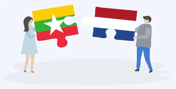Ζευγάρι Που Κρατά Δύο Κομμάτια Παζλ Βιρμανικές Και Ολλανδικές Σημαίες — Διανυσματικό Αρχείο