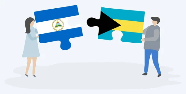 Paar Houden Twee Puzzels Stukken Met Nicaraguaanse Bahamaanse Vlaggen Nicaragua — Stockvector