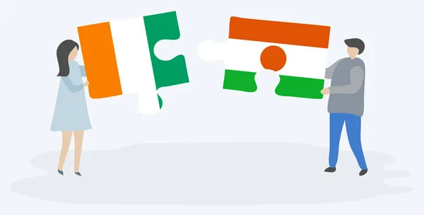 Dvojice Vlajkami Ivoriane Nigerien Drží Dvě Skládanky Národní Symboly Pobřeží — Stockový vektor
