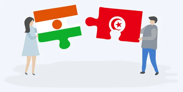 Casal Segurando Duas Peças Quebra Cabeças Com Bandeiras Nigerianas Tunisianas —  Vetores de Stock