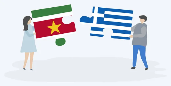 Ζευγάρι Που Κρατά Δύο Κομμάτια Παζλ Σουρινάμ Και Ελληνικές Σημαίες — Διανυσματικό Αρχείο