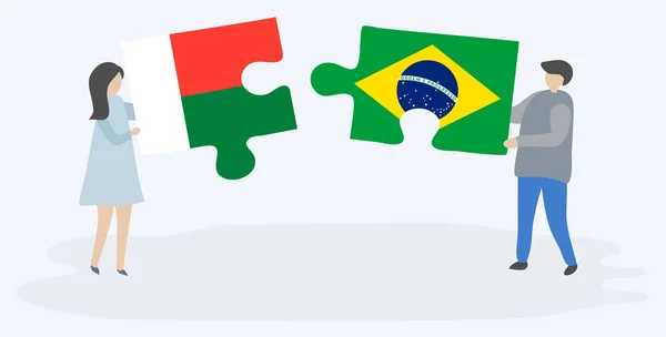 Casal Segurando Duas Peças Quebra Cabeças Com Bandeiras Malgaxes Brasileiras — Vetor de Stock