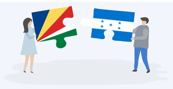 Paar Houden Twee Puzzels Stukken Met Seychellois Hondurese Vlaggen Seychellen — Stockvector