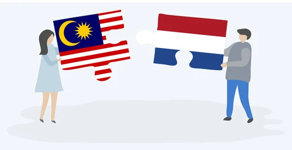 Пара Держащая Две Головоломки Малазийскими Голландскими Флагами Государственные Символы Малайзии — стоковый вектор
