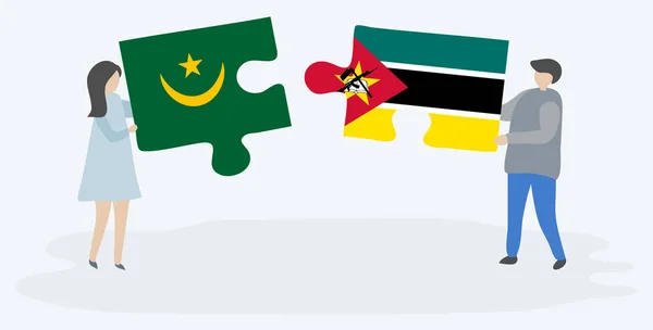 Pareja Sosteniendo Dos Piezas Rompecabezas Con Banderas Mauritanas Mozambiqueñas Mauritania — Vector de stock