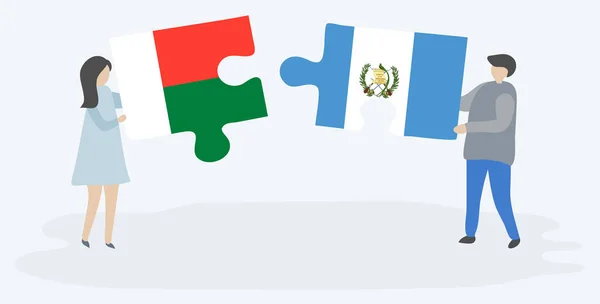 Casal Segurando Duas Peças Quebra Cabeças Com Bandeiras Malgaxes Guatemaltecas — Vetor de Stock