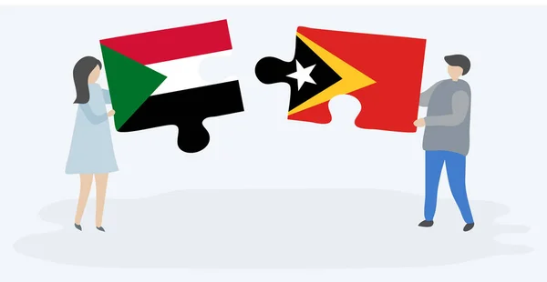 Casal Segurando Duas Peças Quebra Cabeças Com Bandeiras Sudanesas Timorenses — Vetor de Stock