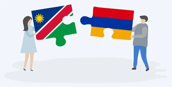 Pareja Sosteniendo Dos Piezas Rompecabezas Con Banderas Namibia Armenia Namibia — Vector de stock