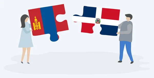 モンゴルとドミニカの旗を持つ2つのパズルピースを保持しているカップル モンゴルとドミニカ共和国のシンボル — ストックベクタ