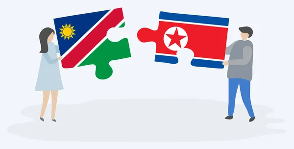 Pareja Sosteniendo Dos Piezas Rompecabezas Con Banderas Namibia Corea Del — Vector de stock