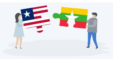 Liberya ve Birmanya bayrakları ile iki bulmaca parçaları tutan çift. Liberya ve Myanmar ulusal sembolleri birlikte.