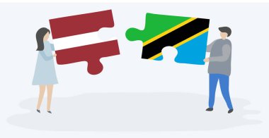 Leton ve Tanzanya bayrakları ile iki bulmaca parçaları tutan çift. Letonya ve Tanzanya ulusal sembolleri birlikte.