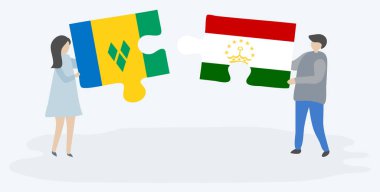 Vincentve Tacikistani bayrakları ile iki bulmaca parçaları tutan çift. Saint Vincent ve Grenadinler ve Tacikistan ulusal sembolleri birlikte.