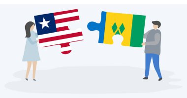 Liberya ve Vincent bayrakları ile iki bulmaca parçaları tutan çift. Liberya ve Saint Vincent ve Grenadinler ulusal semboller birlikte.