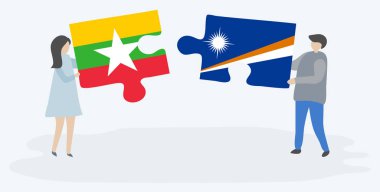 Birmanya ve Marshall bayrakları ile iki bulmaca parçaları tutan çift. Myanmar ve Marshall Adaları ulusal sembolleri birlikte.