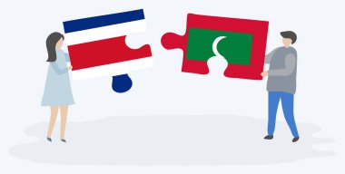 Çift Kosta Rika ve Maldiv bayrakları ile iki bulmaca parçaları tutan. Kosta Rika ve Maldivler ulusal semboller birlikte.