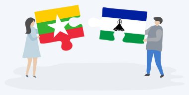 Çift Birmanya ve Basotho bayrakları ile iki bulmaca parçaları tutan. Myanmar ve Lesotho ulusal sembolleri birlikte.