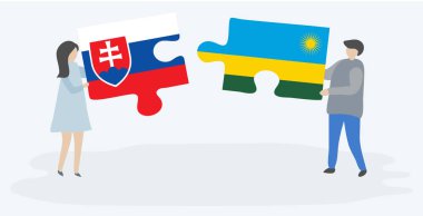 Slovak ve Ruanda bayrakları ile iki bulmaca parçaları tutan çift. Slovakya ve Ruanda ulusal sembolleri birlikte.