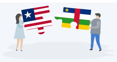 Liberya ve Orta Afrika bayrakları ile iki bulmaca parçaları tutan çift. Liberya ve Orta Afrika Cumhuriyeti ulusal sembolleri birlikte.