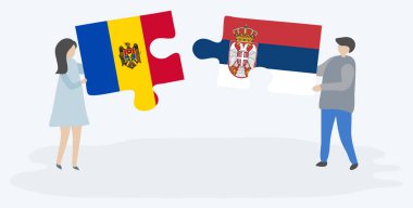Moldova ve Sırp bayraklarıyla iki bulmaca parçası tutan çift. Moldova ve Sırbistan ulusal sembolleri bir arada.
