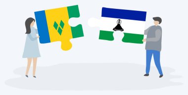 Vincentian ve Basotho bayrakları ile iki bulmaca parçaları tutan çift. Saint Vincent ve Grenadinler ve Lesotho ulusal sembolleri birlikte.