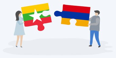 Birmanya ve Ermeni bayraklarıyla iki bulmaca tutan çift. Myanmar ve Ermenistan ulusal sembolleri bir arada.
