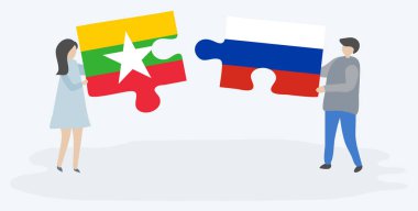 Çift Birmanya ve Rus bayrakları ile iki bulmaca parçaları tutan. Myanmar ve Rusya ulusal sembolleri birlikte.