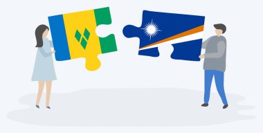 Vincentve Marshall bayraklarıyla iki bulmaca tutan çift. Saint Vincent ve Grenadinler ve Marshall Adaları ulusal sembolleri birlikte.