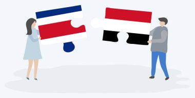 Çift Kosta Rika ve Yemen bayrakları ile iki bulmaca parçaları tutan. Kosta Rika ve Yemen ulusal sembolleri birlikte.