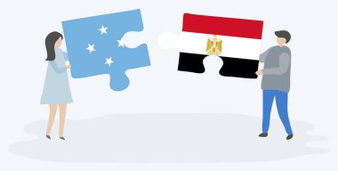 Mikronezya ve Mısır bayrakları ile iki bulmaca parçaları tutan çift. Mikronezya ve Mısır ulusal sembolleri birlikte.