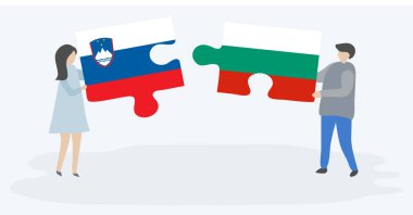 Sloven ve Bulgar bayraklarıyla iki bulmaca parçası tutan çift. Slovenya ve Bulgaristan ulusal sembolleri bir arada.